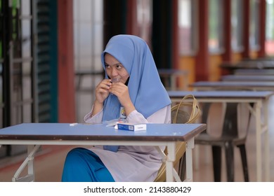 Muadzam Shah, Malaysia - April 7th, 2022 : Lateral-Flow-Test Covid Rapid Home-use Test Kit For Saliva - Step 2 - Spit With Mouth Through Funnel In Plastic Tube To Collect Sample.