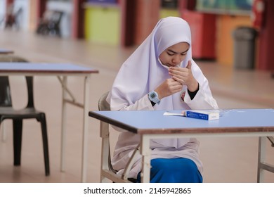 Muadzam Shah, Malaysia - April 7th, 2022 : Lateral-Flow-Test Covid Rapid Home-use Test Kit For Saliva - Step 2 - Spit With Mouth Through Funnel In Plastic Tube To Collect Sample.