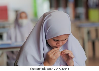 Muadzam Shah, Malaysia - April 7th, 2022 : Lateral-Flow-Test Covid Rapid Home-use Test Kit For Saliva - Step 2 - Spit With Mouth Through Funnel In Plastic Tube To Collect Sample.