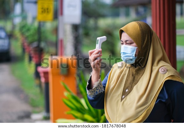 Muadzam Shah, Malaysia- August 4th,\
2020 : Coronavirus check post on street car  doctors checking body\
temperature corona virus covid-19\
epidemic.\
Keywords