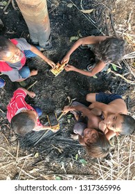 Muadzam Shah, Malaysia - February 19th, 2019 : A Goup Of Aboriginal Children Playing Under The Tree At Muadzam Shah, Malaysia