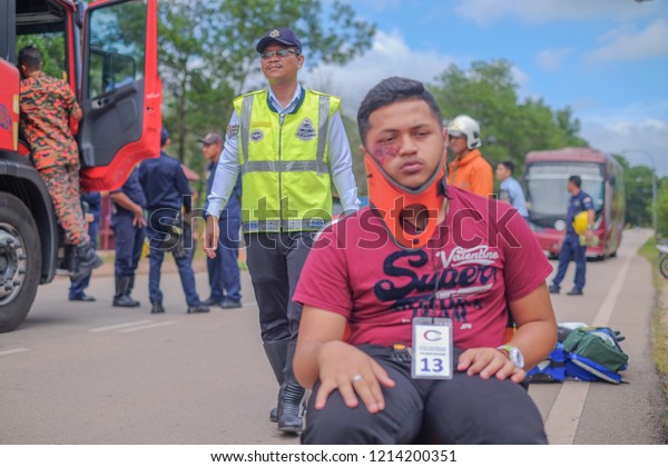 Muadzam Shah, Malaysia -\
October 18th, 2018 : Young man injured looks stressful, sitting on\
wheelchair  Inter Agency Disaster Training Program 2018 at Muadzam\
Shah.