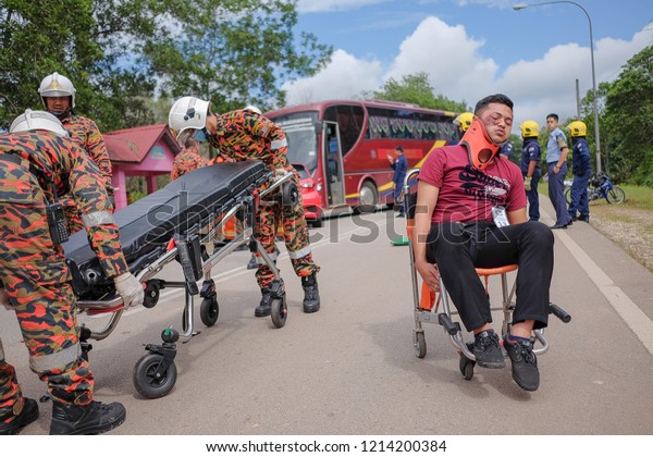 Muadzam Shah, Malaysia -\
October 18th, 2018 : Young man injured looks stressful, sitting on\
wheelchair  Inter Agency Disaster Training Program 2018 at Muadzam\
Shah.