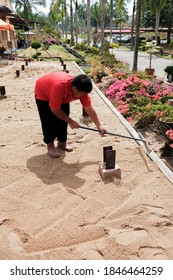 Muadzam Shah, Malaysia -  October  28th, 2020 : Construction worker in leveling work, soil and site preparation for landscaping.
