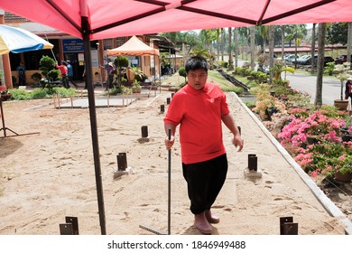 Muadzam Shah, Malaysia -  October  28th, 2020 : Construction worker in leveling work, soil and site preparation for landscaping.