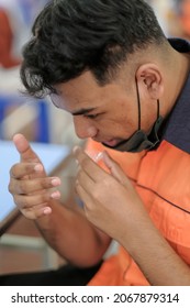 Muadzam Shah, Malaysia - October 31th, 2021 : Lateral-Flow-Test Covid Rapid Home-use Test Kit For Saliva - Step 2 - Spit With Mouth Through Funnel In Plastic Tube To Collect Sample.