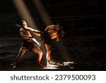 Muay Thai boxers with kick boxing action, thai fighters training boxing in the dark