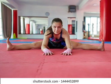 Muay thai female fighter stretching and warming
