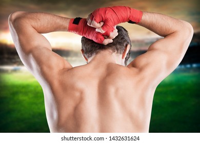 Muay Thai or Kickboxing man on stadium background