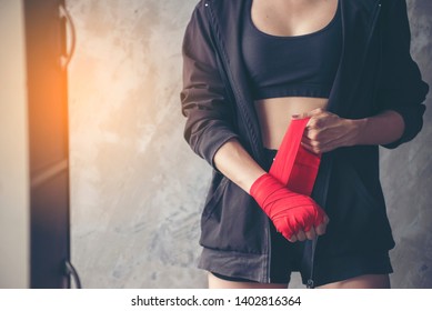 Muay Thai Woman And Healthy Concept. Boxing Women Prepare To Trianing Session And Kickboxing, Workout At Thai Boxing Gym. Fit Female Exercise Hard To Strengther Muscle.