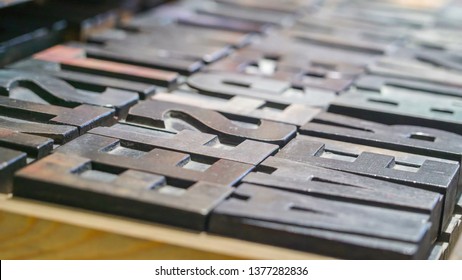 Much Closer Look Of The Metal Letter Stamps On The Cabinet Tray Used To Print In The Station