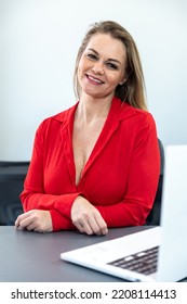 Much Older Businesswoman With Blonde Hair Sitting In Front Of Her Computer In The Office, Successful Woman