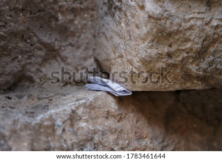 Much publicised practice of placing slips of paper containing written prayers into the crevices of the Wailing Wall.