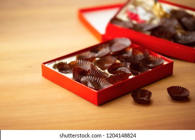 Too Much Sweets, Too Much Calories. Excess Eating. Empty Box Of Chocolates Or Confectionery.