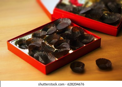 Too Much Sweets, Too Much Calories. Excess Eating. Empty Box Of Chocolates Or Confectionery.