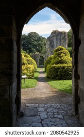 Much Wenlock, Shropshire, England, Britain, Jul 17th 2016. View Through Doorway To The Garden In St Milburgas  12th Century Anglo Saxon Priory.