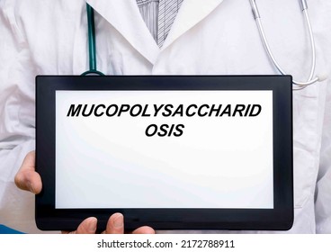 Mucopolysaccharidosis.  Doctor With Rare Or Orphan Disease Text On Tablet Screen Mucopolysaccharidosis