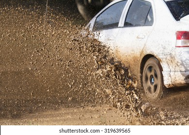 Mud Debris Splash From A Rally Car ( Focus At Mud Debis)