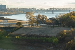 Mud Island River Park With Memphis Sign And Harahan Bridge Over Mississippi River As Seen From  Memphis Suspension Railway Footbridge On Sunset In Memphis Tennessee  