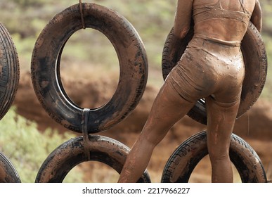 Mud Race Runner. Old And Used Tyres Crawl Constructions Obstacle Course