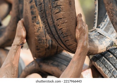 Mud Race Runner. Old And Used Tyres Crawl Constructions Obstacle Course