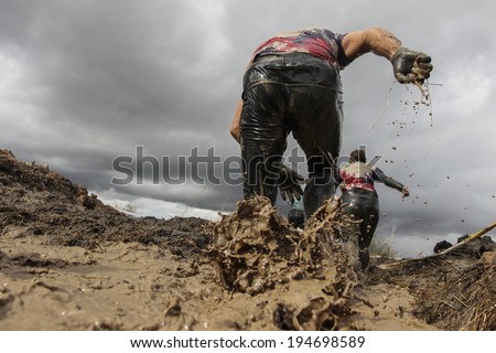 Mud race runners