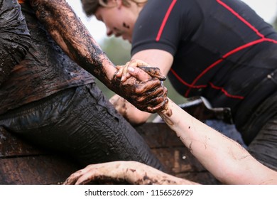 Mud Race Runners During Extreme Obstacle Races