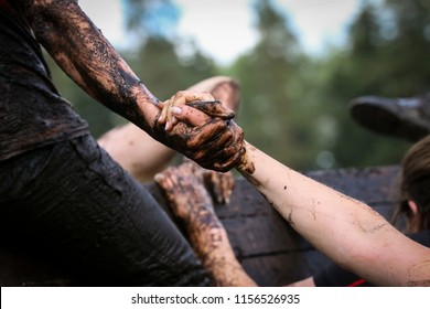 Mud race runners during extreme obstacle races