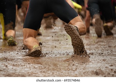 Mud Race Runnerscrawlingpassing Under Barbed Wire Stock Photo 693574846 ...