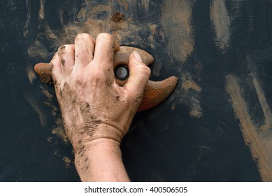 Mud Race Runners,hand Grasping Onto A Wall Climbing Handhold