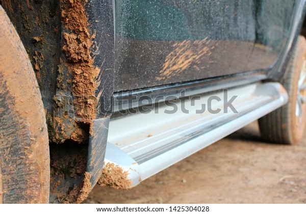 Mud soil stuck under the\
car\'s belly