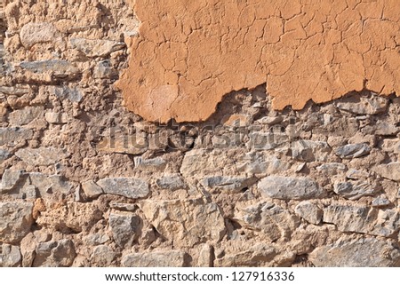 Mud and stone wall texture for background