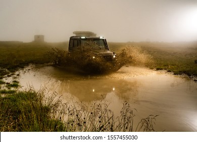 Mud And Water Splash In Off-road Racing. Off Road Car. Beautiful Nature. Truck Car Wheel On Offroad Steppe Adventure Trail