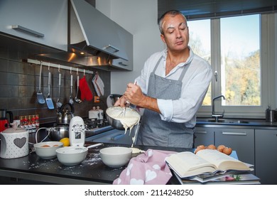 muddler cook tries to prepare a cream cake - Shutterstock ID 2114248250