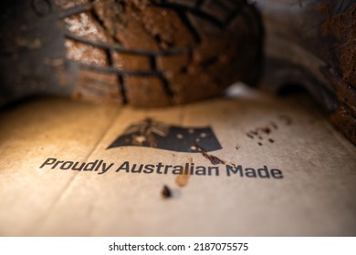 Muddy Boots On A Farm In Australia. Dirty Shoes Covered In Dirt And Foot And Mouth Disease. Bio Security To Stop Contaminated Footwear And Clothes Spreading Disease In Cows