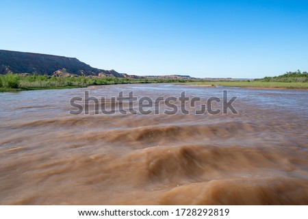Muddy Brown Waters of the Virgin River south of Bunkerville, Nevada shortly before it flows into Lake Mead and the Colorado River.