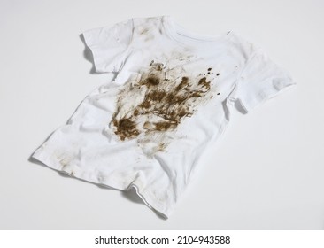muddy and dirty white t-shirt - Shutterstock ID 2104943588