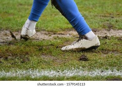 Muddy Football - Soccer Player Standing On The Line / Muddy Boots