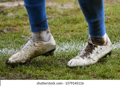 Muddy Football - Soccer Player Standing On The Line / Muddy Boots