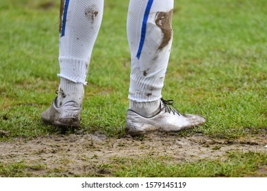 Muddy Football - Soccer Player Standing On The Line / Muddy Boots