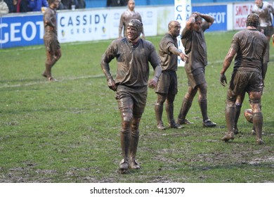 Muddy Rugby Players