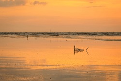Muddy Seashore With Foldable Crab Trap Net During Sunset At Kuala Kangkung,Kedah