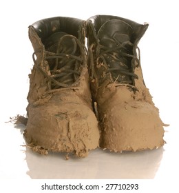 Muddy Work Boots Isolated On A White Background