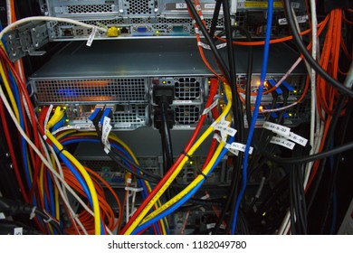 Mueang, Lamphun, Thailand - August 17, 2018: The connection of server in back view with sticker label that are installed in the rack cabinet. - Shutterstock ID 1182049780