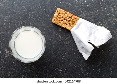 Muesli Bar And Milk On Kitchen Table