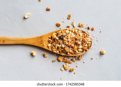 Muesli or granola on gray background. Healthy food concept.