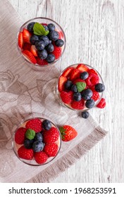 Muesli With Yogurt And Berries In A Glass On A Wooden Table. Fitness Food. Copy Space. View From Above. Flat Lay.High Quality Photo