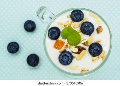 Muesli with yogurt and blueberries - healthy breakfast 