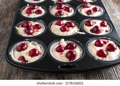 Muffin Batter In A Baking Pan Isolated On Wooden Table, 