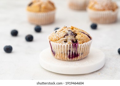 Muffin white with blueberries white background . High quality photo